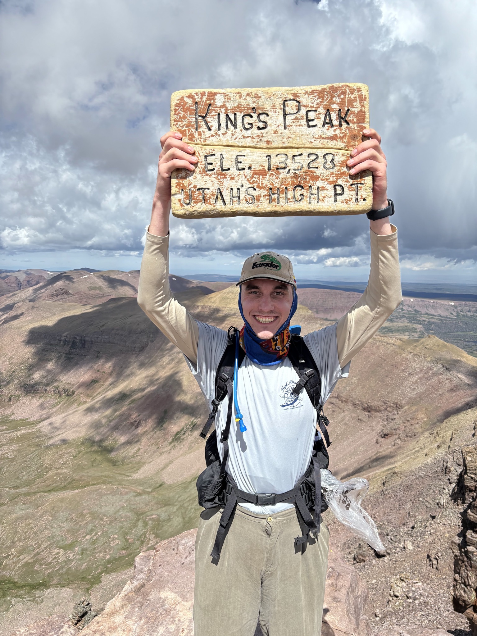 Jacob Anderson backpacking in the mountains wearing hiking gear